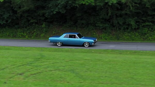 Aerials of Classic Car on Road Clip 1 vfx asset stock footage