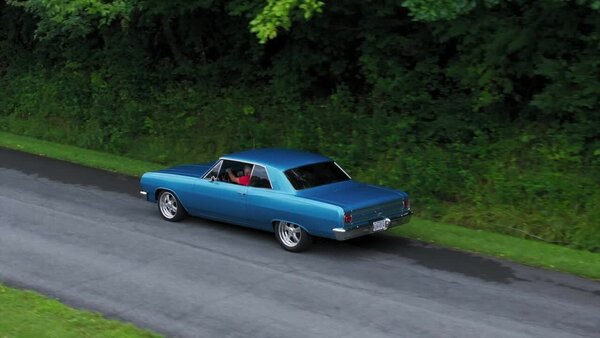 Aerials of Classic Car on Road Clip 4 vfx asset stock footage