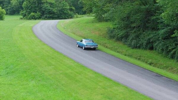 Aerials of Classic Car on Road Clip 5 vfx asset stock footage