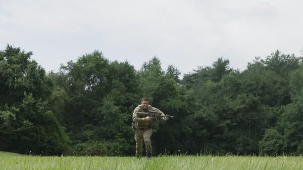 Soldier Running Through Field