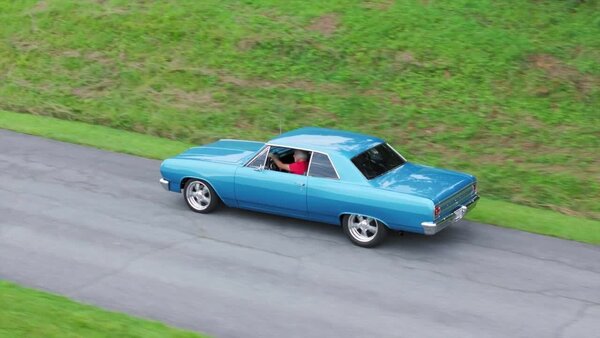 Aerials of Classic Car on Road Clip 6 vfx asset stock footage