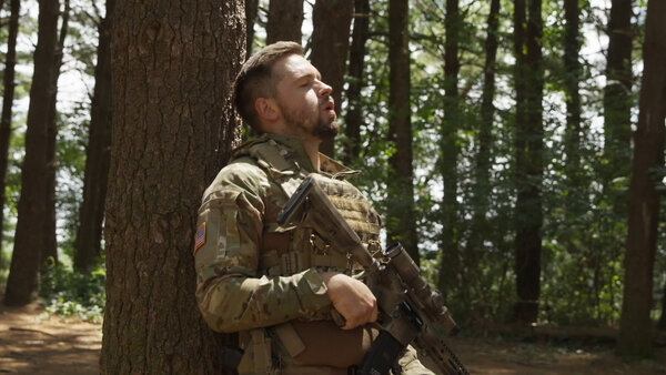 Soldier Evades Gunfire in Woods