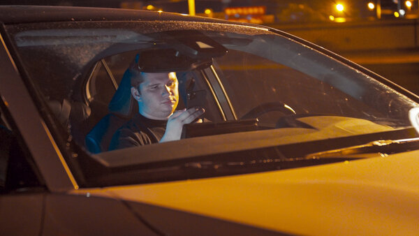 Man in Car Looking at Phone Clip 2 vfx asset stock footage